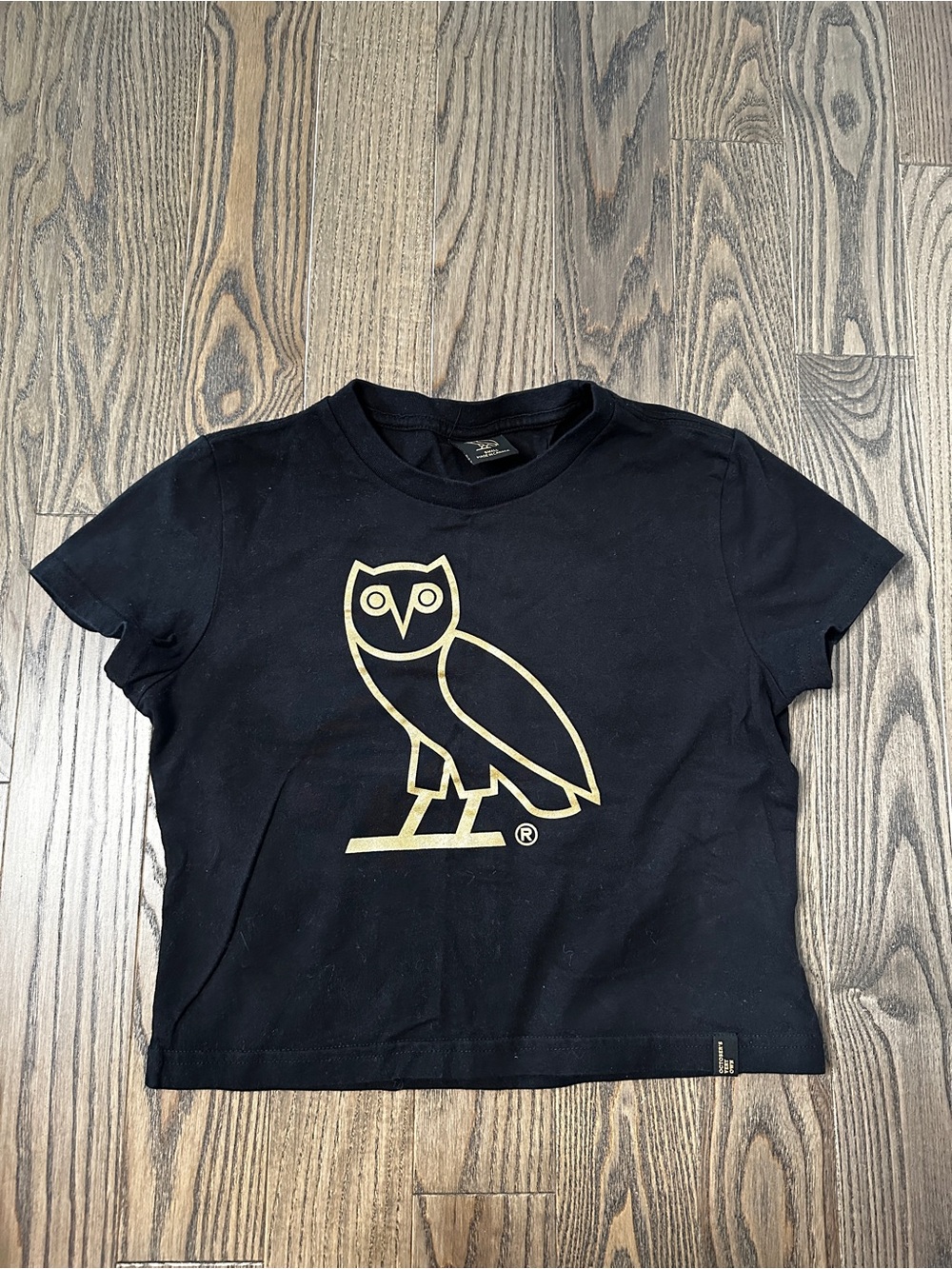 OVO Cropped Black Short-Sleeve Tee with Gold Owl Graphic